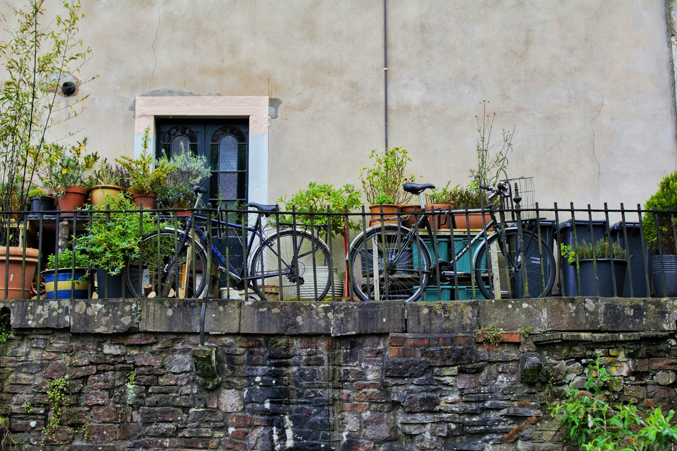 there is an old bicycle outside on a balcony