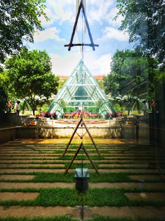 an abstract picture with a big glass greenhouse in the background