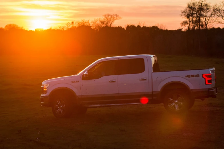 the pickup truck is driving in the dark