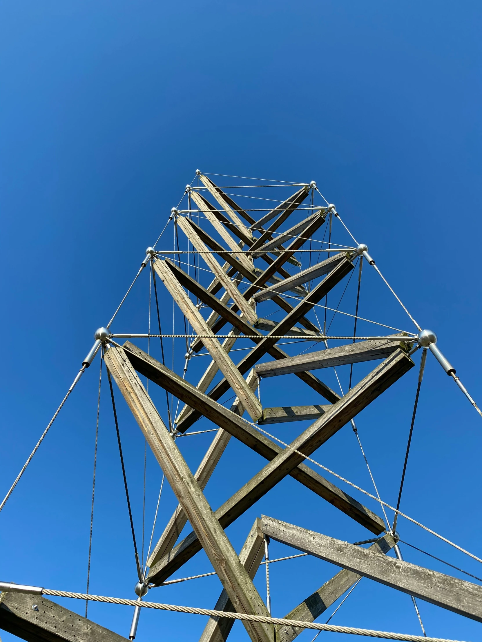 a pole reaching up into a blue sky