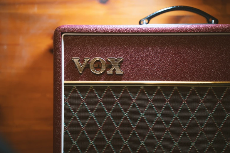 the word vox is spelled on the old amp