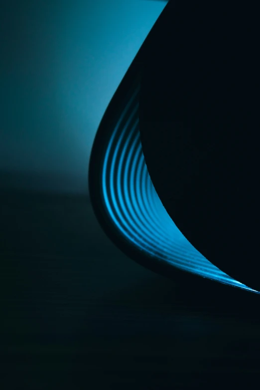 a view of a curved piece of electronic equipment in the dark