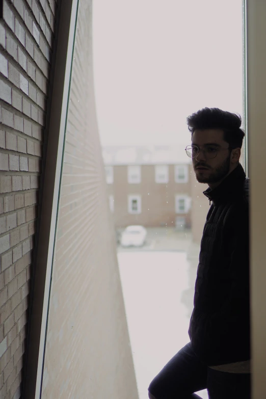 a young man looking out the side door