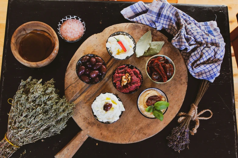 a table with two trays and plates of desserts