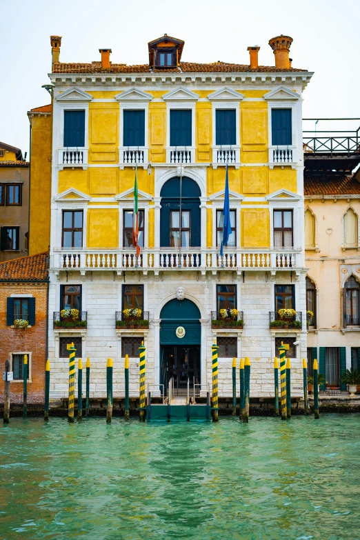 a house next to the water in a canal