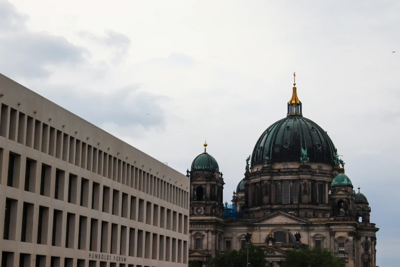 a large building with two towers with a clock on it