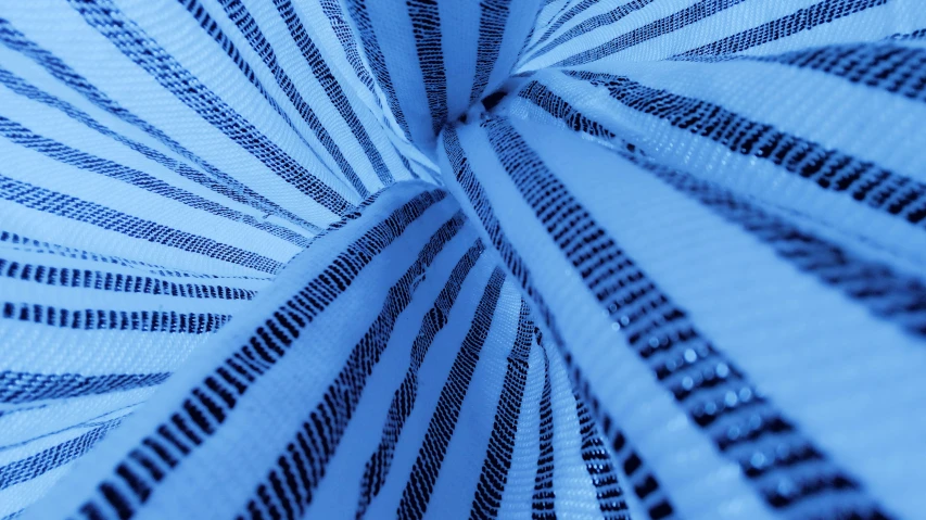 a blue and white umbrella has a pattern on it