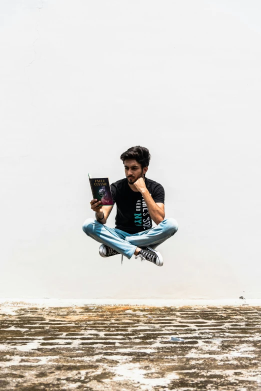 a man flies through the air with his laptop