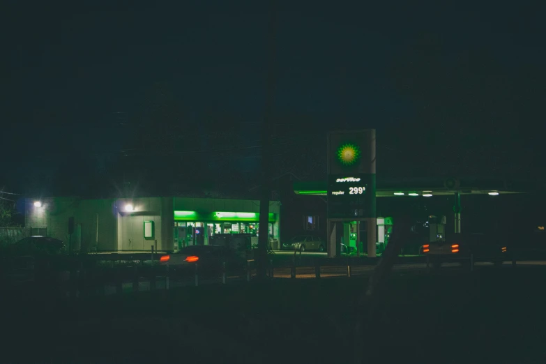 this is an image of a gas station at night