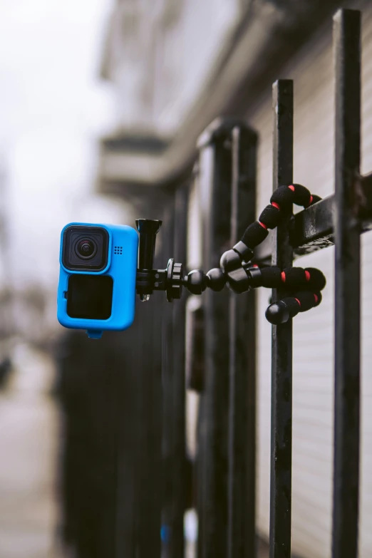 a camera attached to the back of a rail