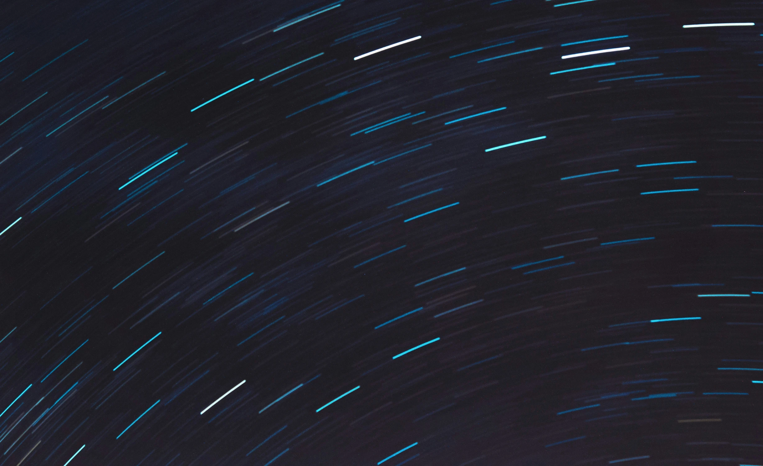 stars streak across the night sky in this image