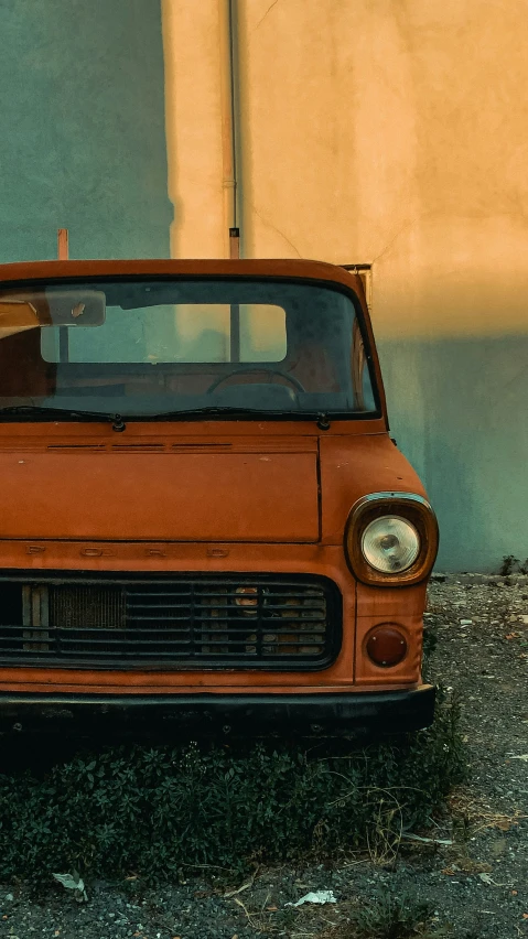 a old rusty car sitting in a field