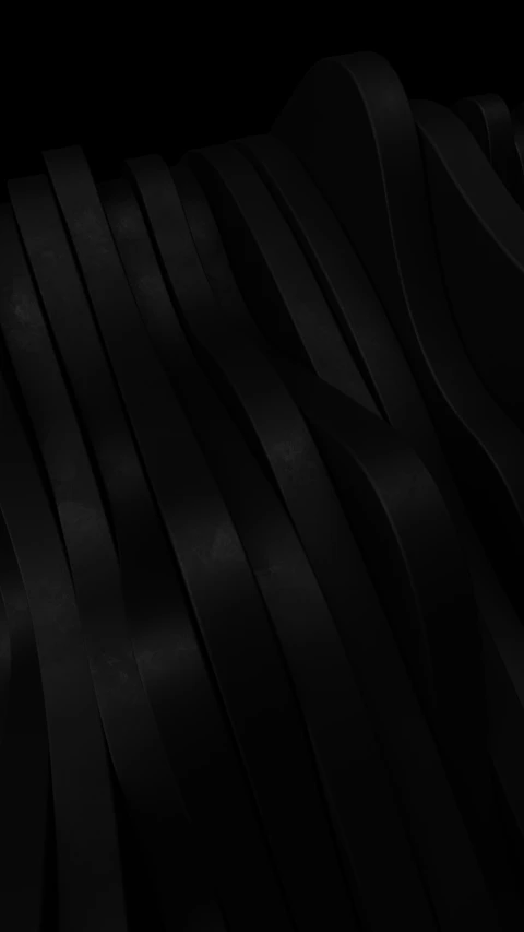 a black background with pleated fabric on it