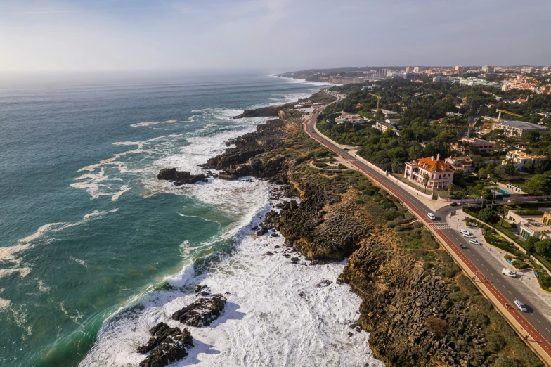 an aerial view of a beach next to the ocean