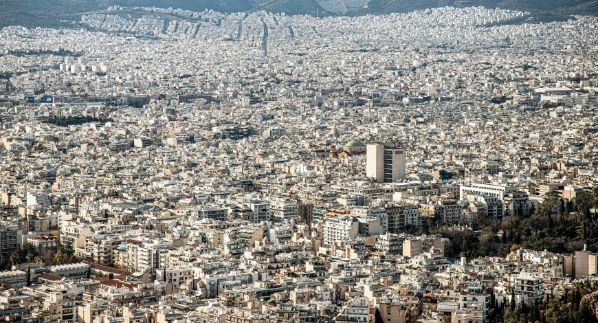 an aerial view of a city and surrounding hills
