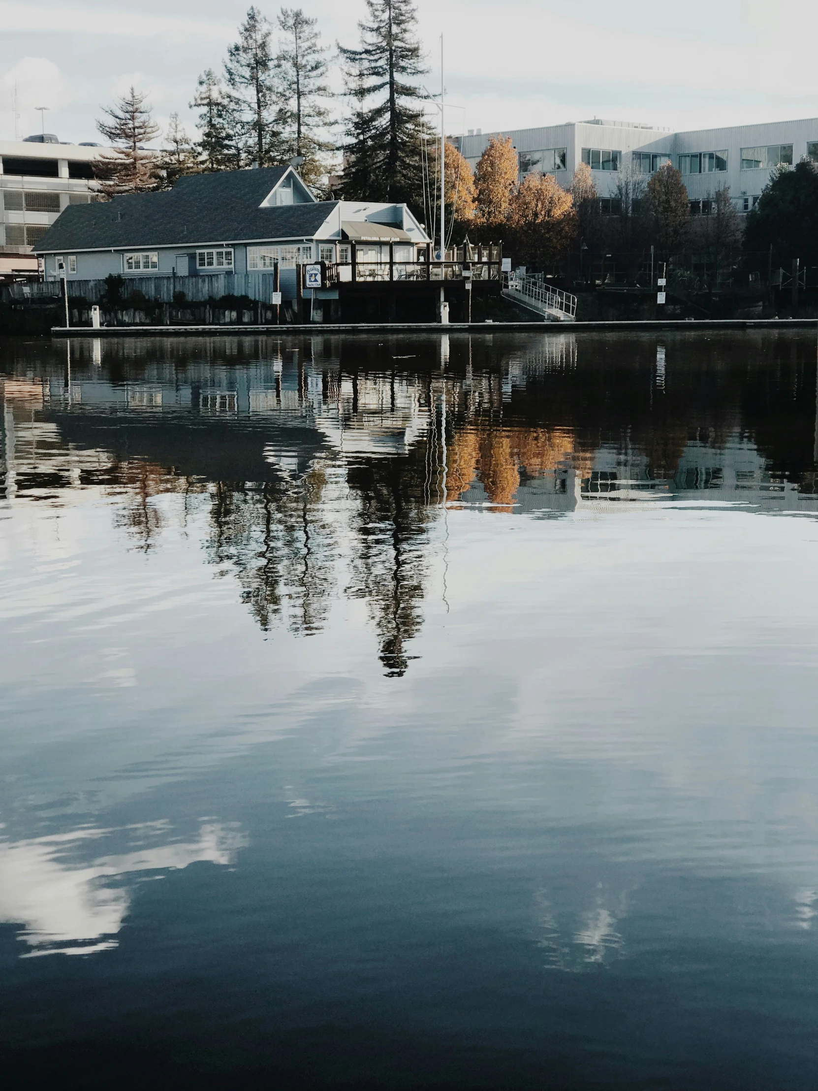 a small white boat is in the water