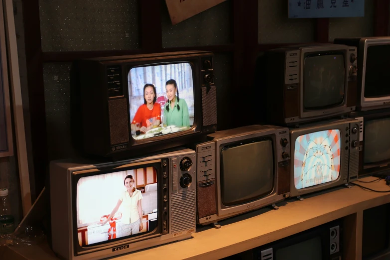 a bunch of tvs that are on display