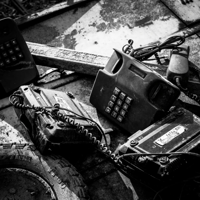 a black and white po shows a broken old phone