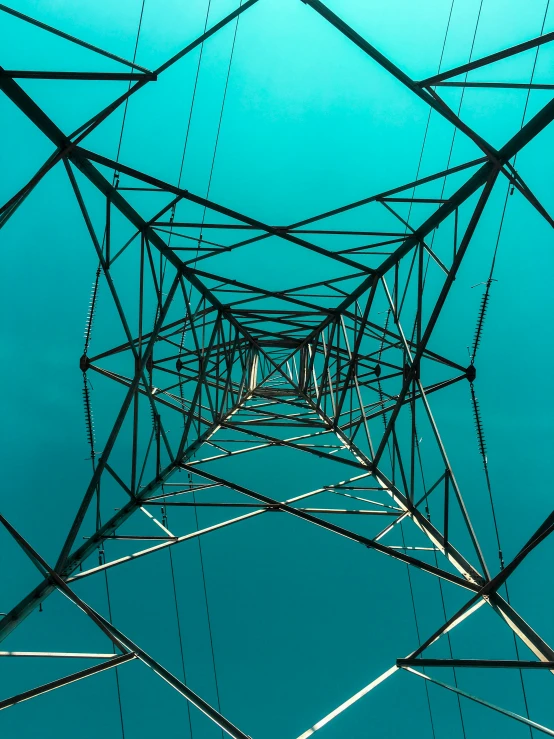 a view from below of a power line structure