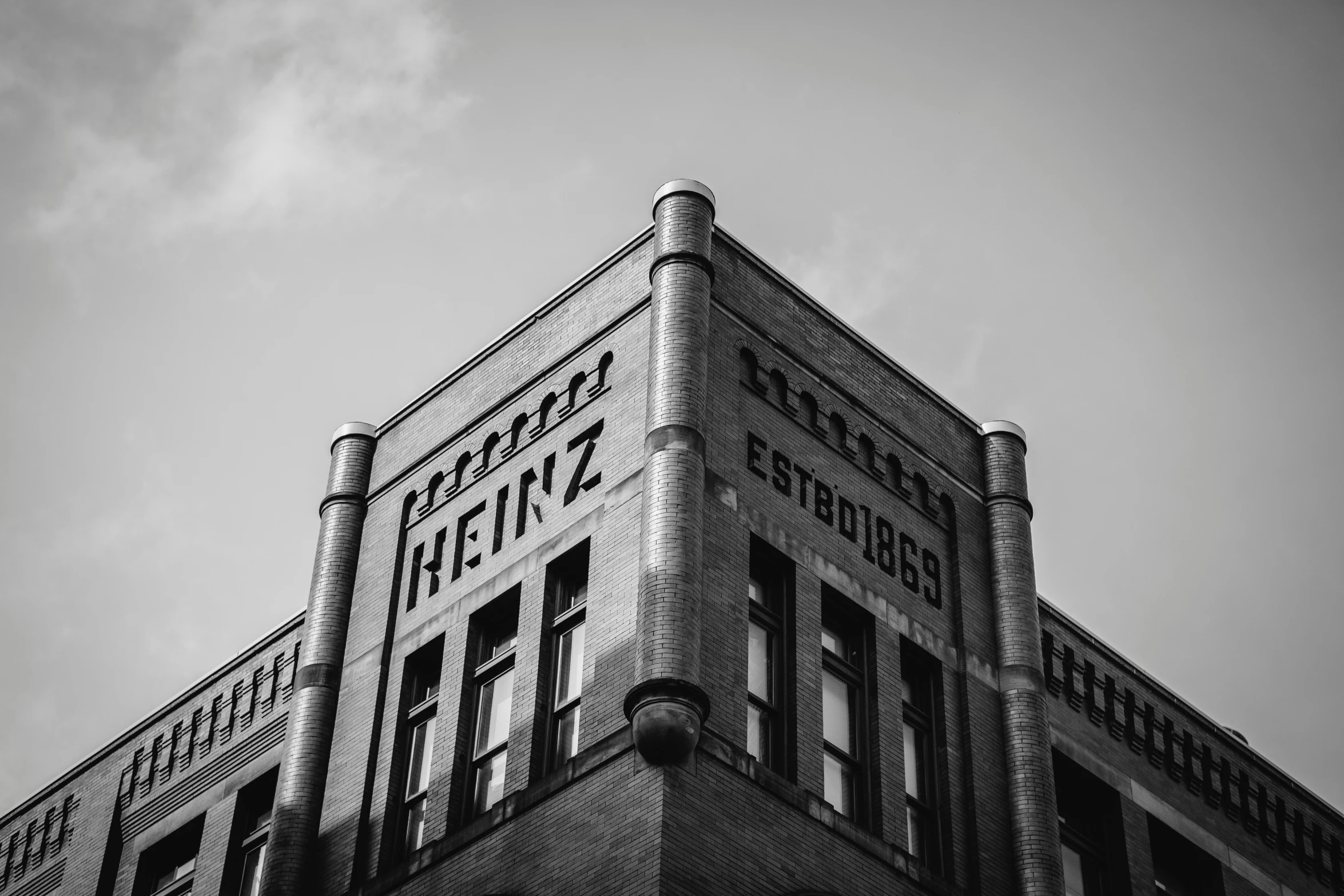 this is an image of a black and white po of a brick building