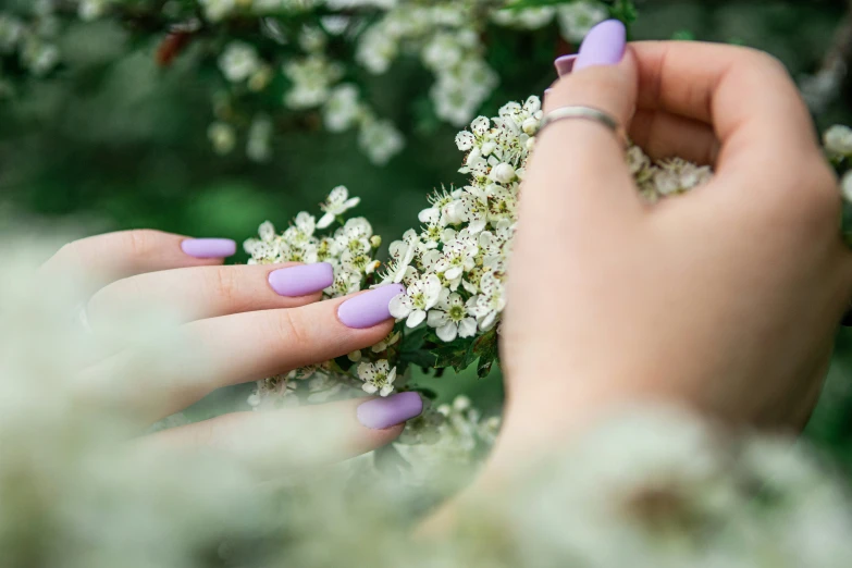 the girl is putting on a pair of manicures