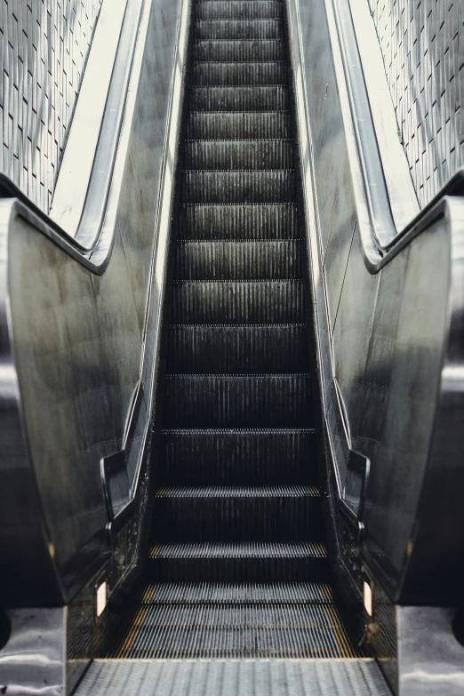 a large set of escalators in a building