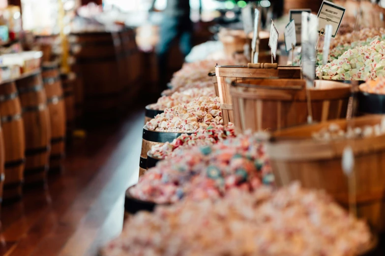 a table with many buckets of sugary treats