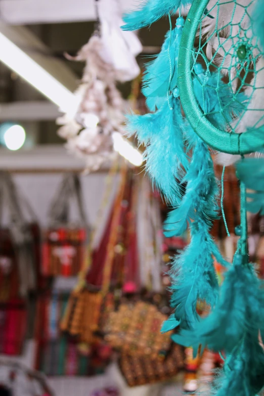 several pieces of blue colored hanging ornament in store