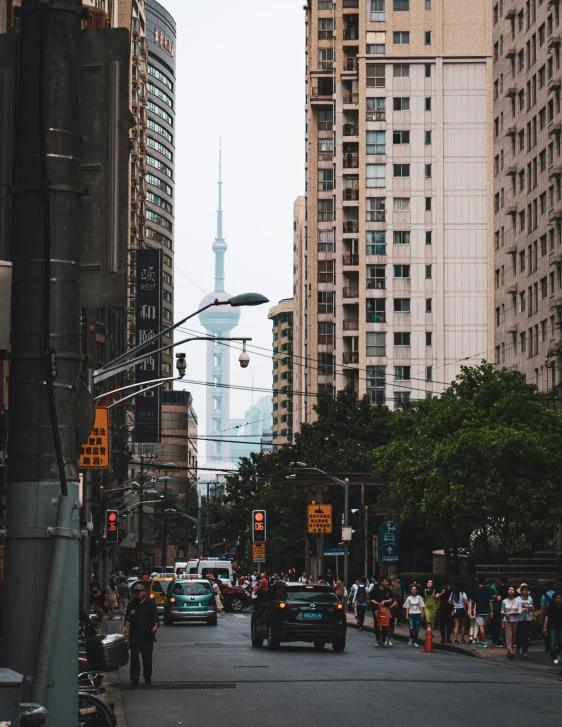 a busy city with cars and people in the street