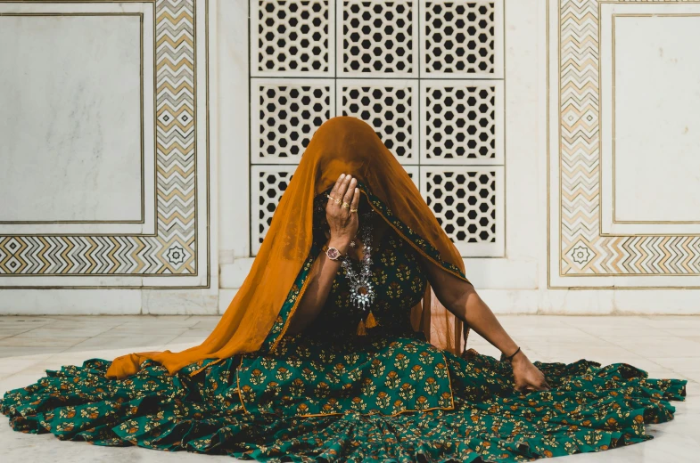 a woman sitting in an indian clothing