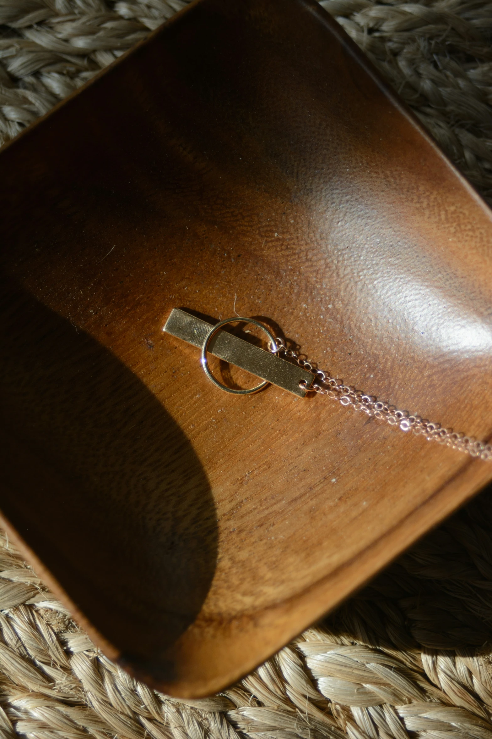 a wooden bag sitting on top of a rug