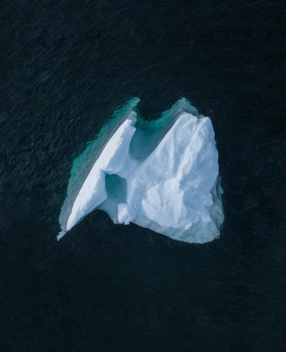 an aerial view of some ice near the water