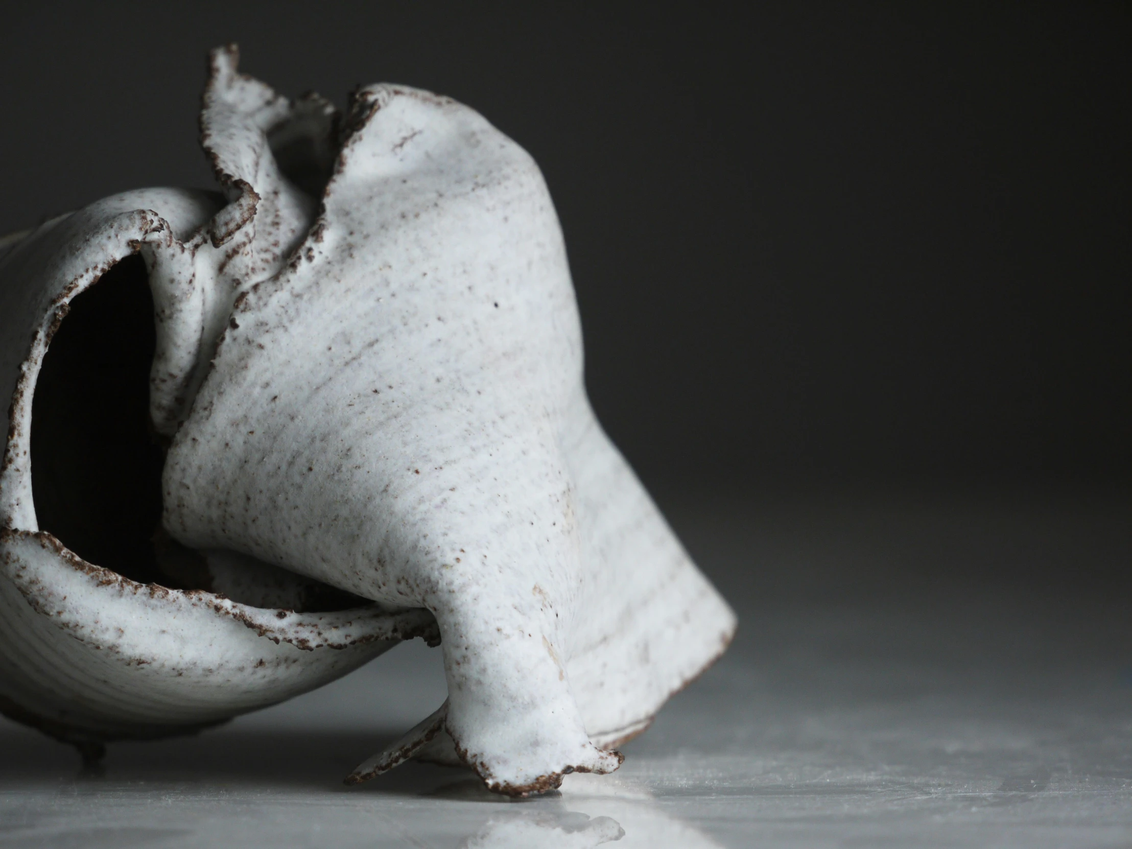 a broken vase sitting on top of a table