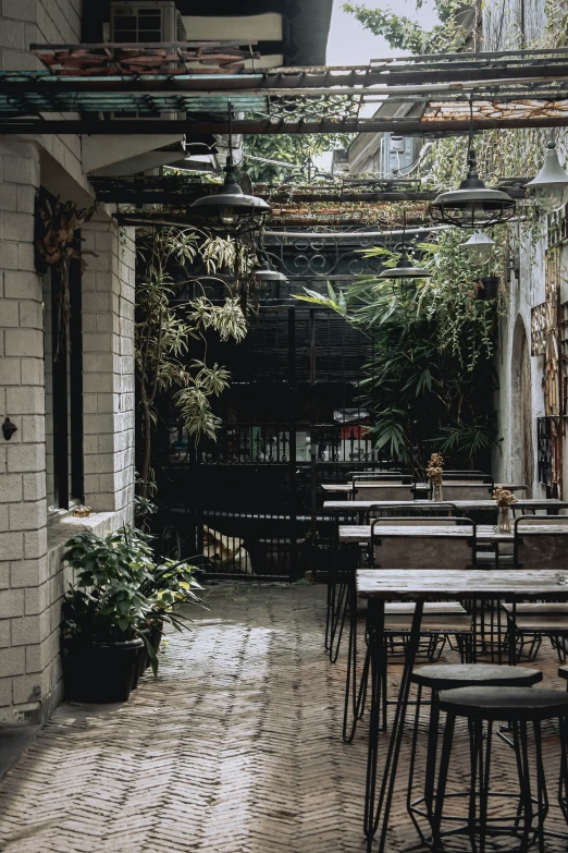 a wooden patio set with a bunch of tables