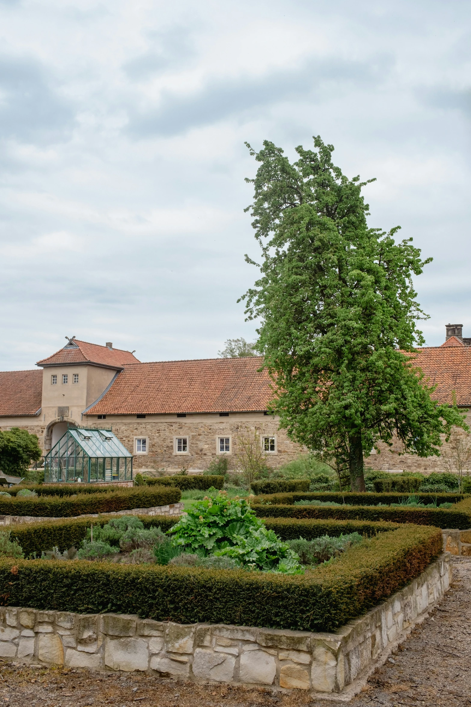 a very nice building surrounded by greenery and trees