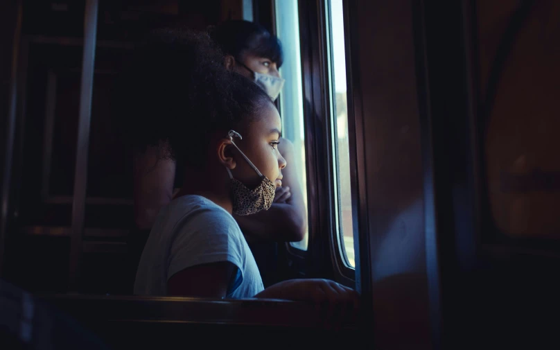 a child wearing ear phones in the dark