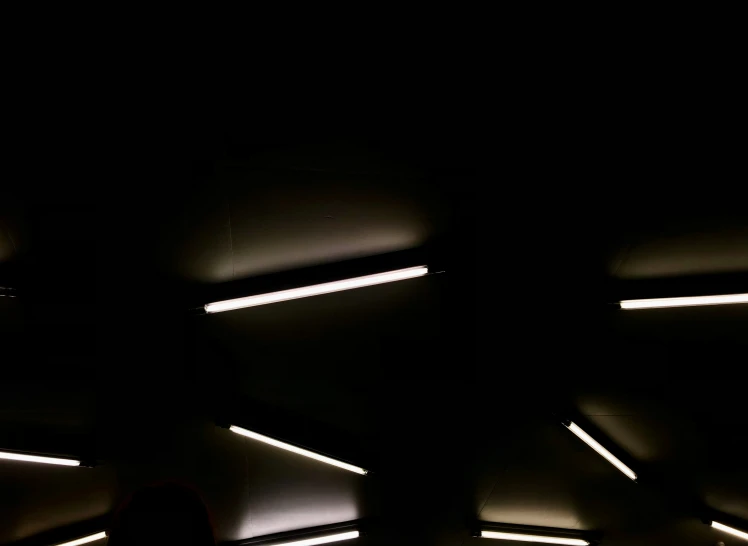 silhouettes in the background of an abstract light tunnel