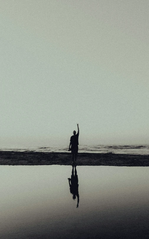 two people are flying a kite on the beach