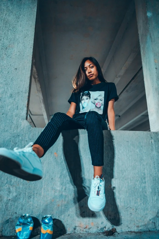 a girl sitting on steps with her legs crossed