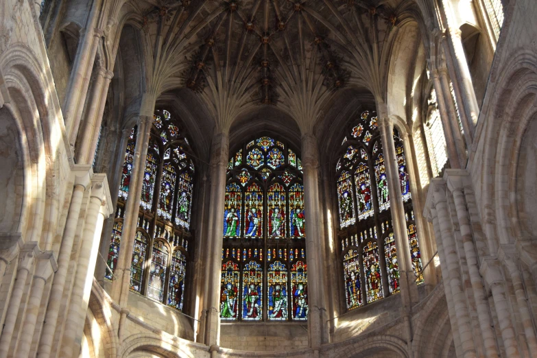 an elaborate church is shown with a lot of stained glass windows