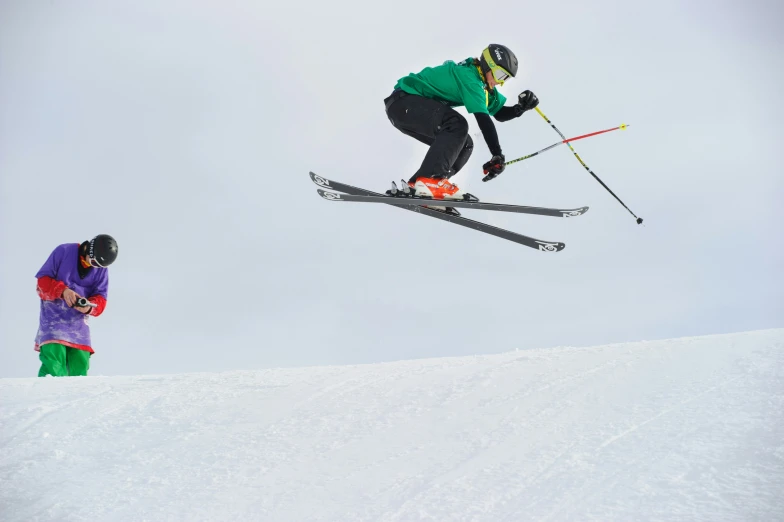 a man flying through the air while riding skis