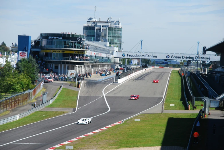 a person in racing car on the side of the road