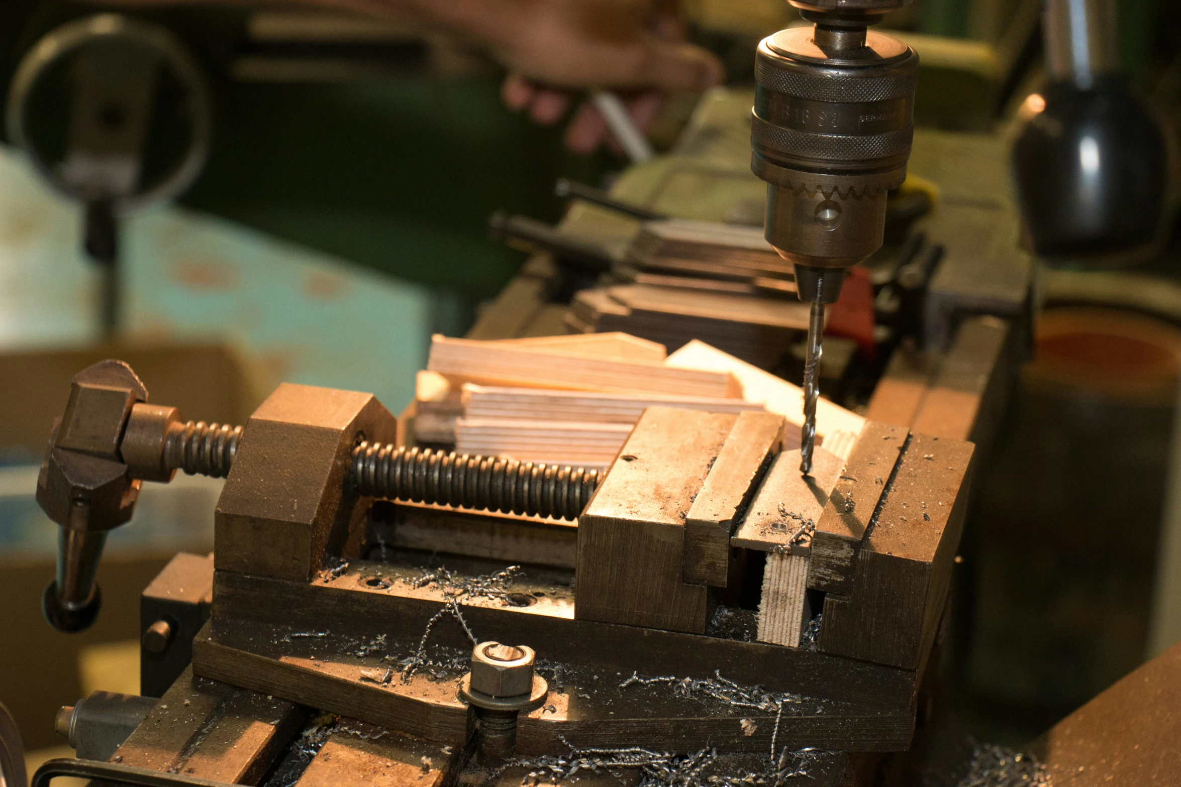 an electric machine making wooden planks in a factory