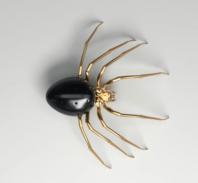 a gold sculpture of a spider on a white surface