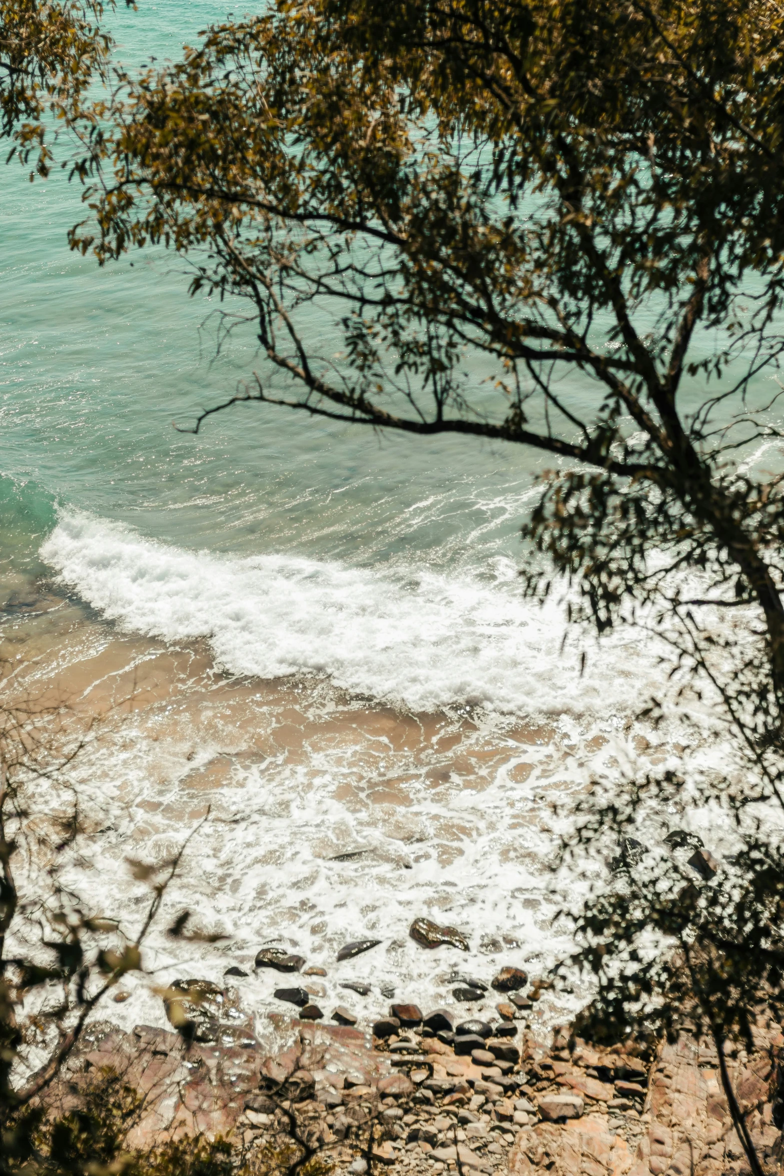 waves splashing about on the rocks in the water