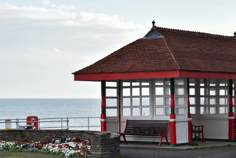 an outdoor pavilion with a view of the ocean