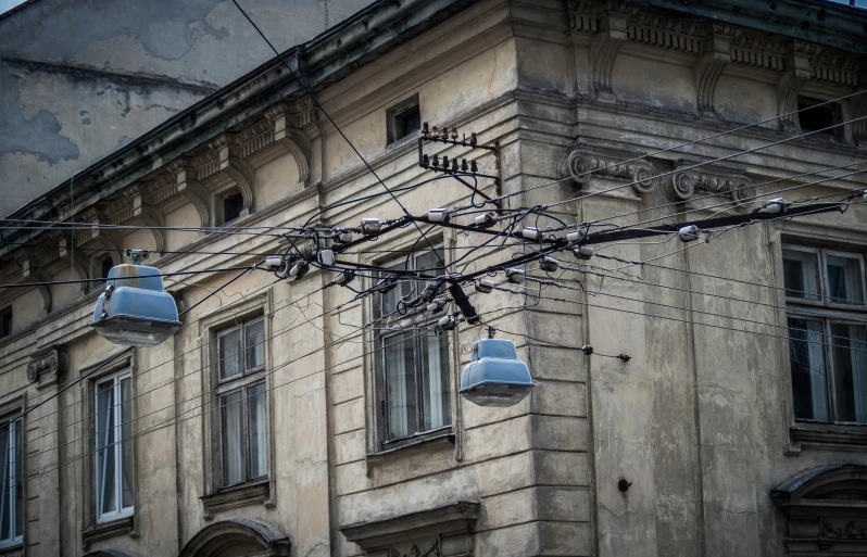 a building with many blue things on the wires