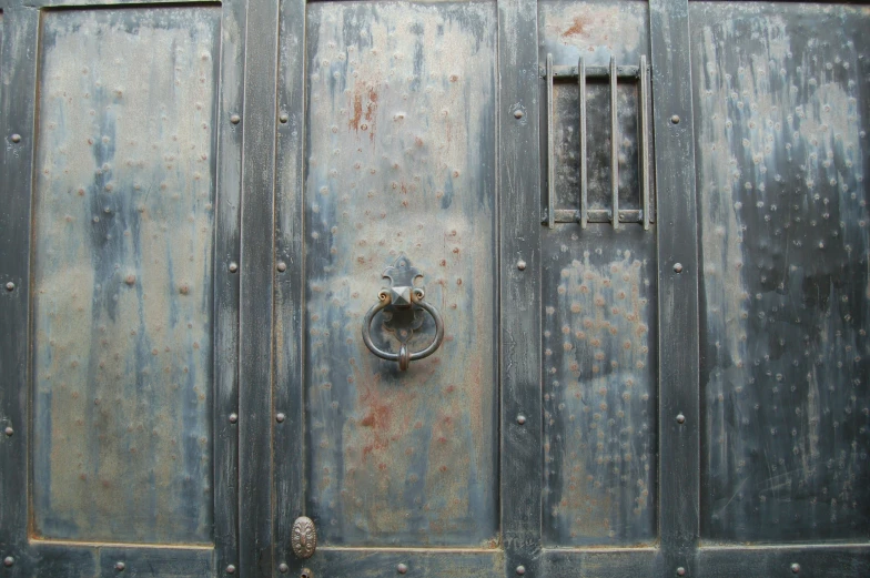 a close up view of metal door hardware