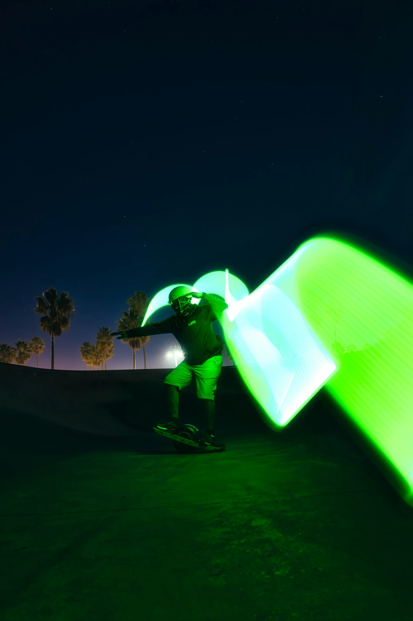 a man riding a skateboard while holding an umbrella