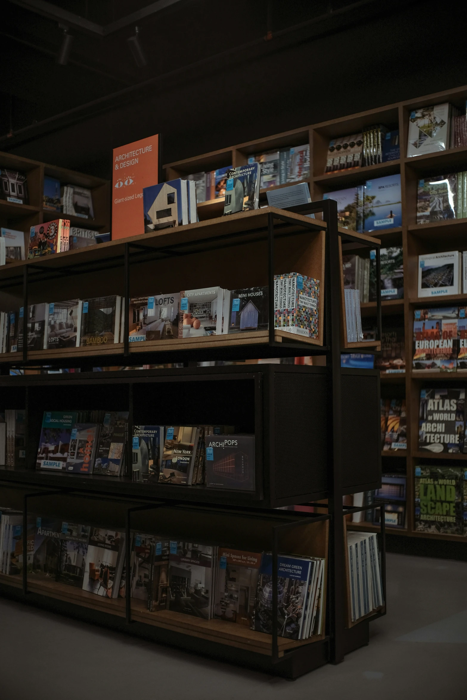 a couple of books sit on shelves with their covers closed